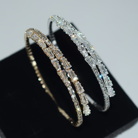 Elegant silvery-plated bracelet with cubic zirconia in classic single row design for weddings and everyday glam.