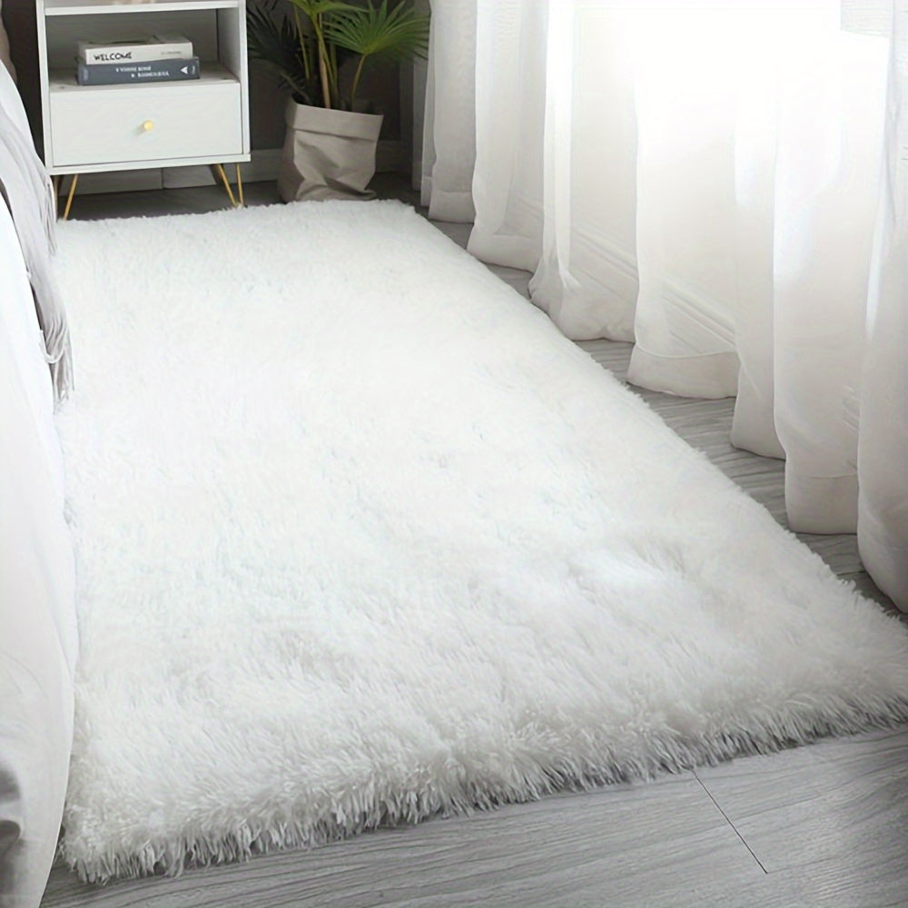 Soft and luxurious pure white plush area rug, ideal for bedroom, living room, and dorm décor. Made from machine washable polyester for easy care.