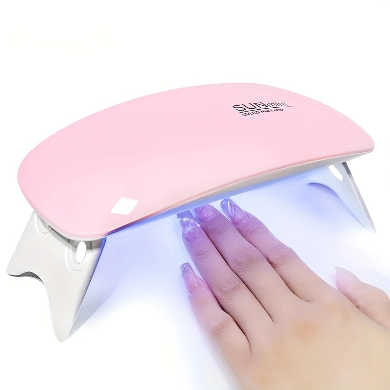 Compact USB-powered nail dryer lamp with foldable design and 6 UV/LED beads for fast gel polish drying on hands and feet.