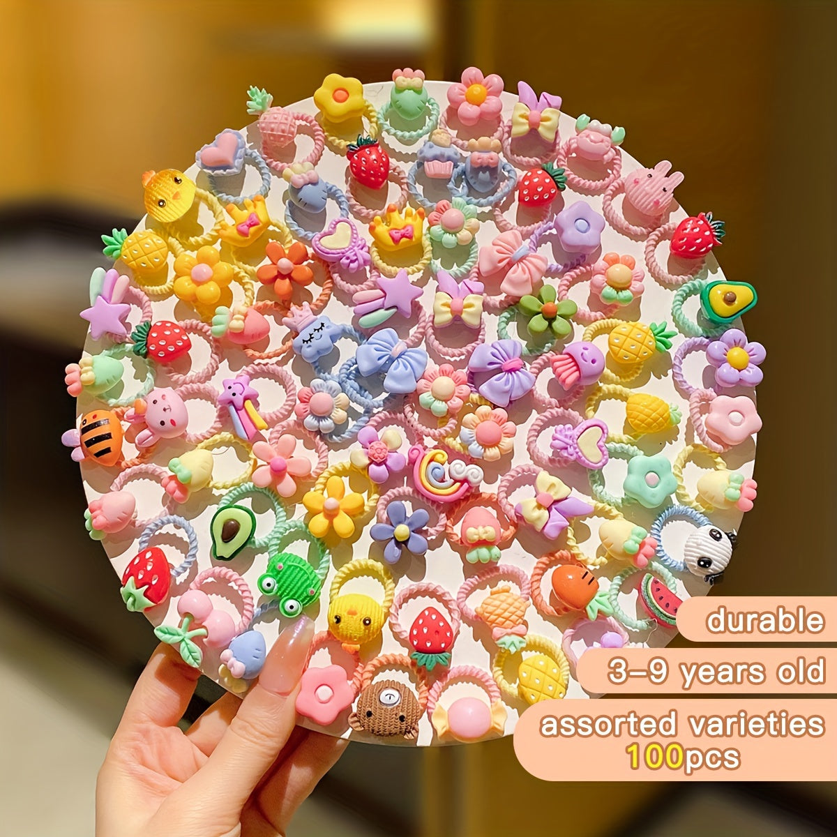 1 hair ring out of 100 colorful, cute cartoon threaded hair accessories.