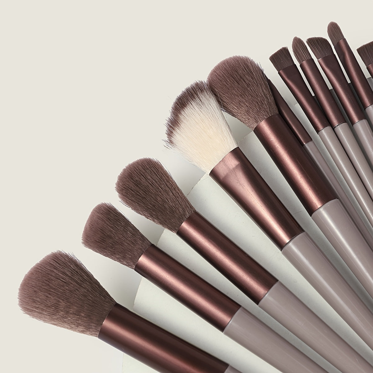 13-piece Makeup Brush Set with ultra soft, quick-dry bristles and matching fabric storage bag. Ideal for beauty enthusiasts.