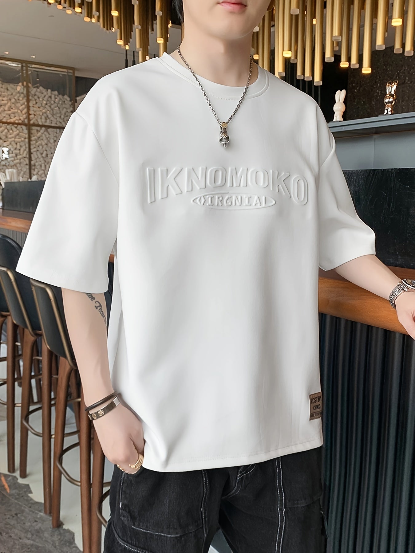 Men's Casual Short Sleeve T-Shirt made of breathable polyester fabric with letter pattern, relaxed fit for summer wear.