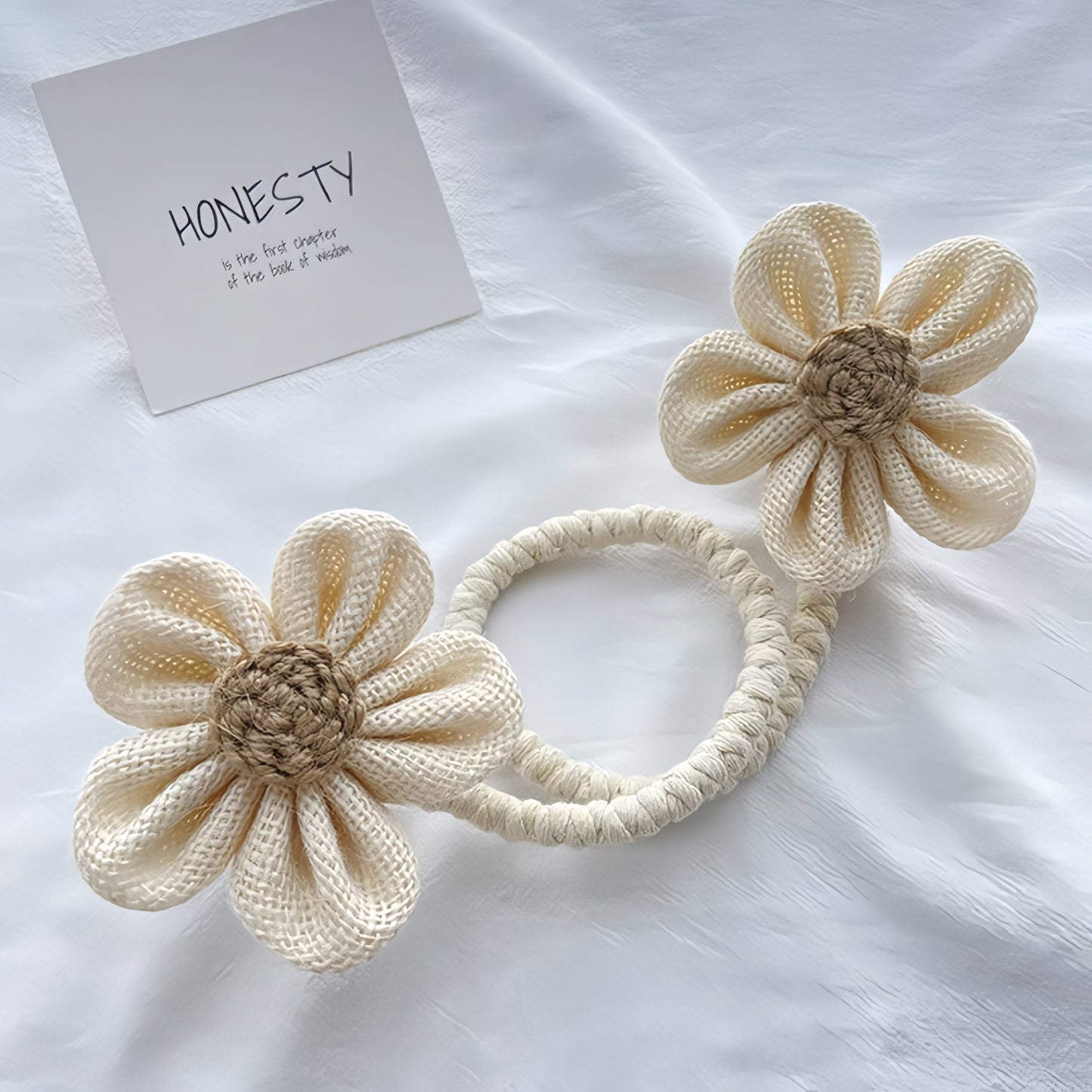 Multipack of handcrafted flower knot curtain tiebacks made from boho style cotton and linen - perfect decorative holdback clips for living room, bedroom, and home decor.