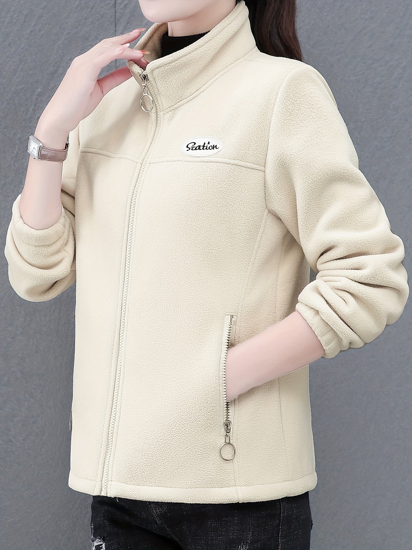 Women's casual fleece jacket with alphabet pattern, stand collar, long sleeves, regular fit, oversized, and zipper detail.