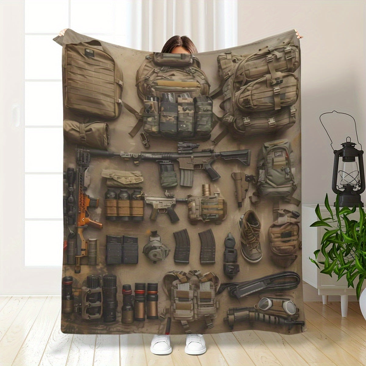 Modern military-inspired flannel throw blanket featuring a hypoallergenic, all-season knit fabric that is lightweight and soft to the touch. Versatile for travel, office use, and home decor, with a digital print tactical equipment design. Perfect for