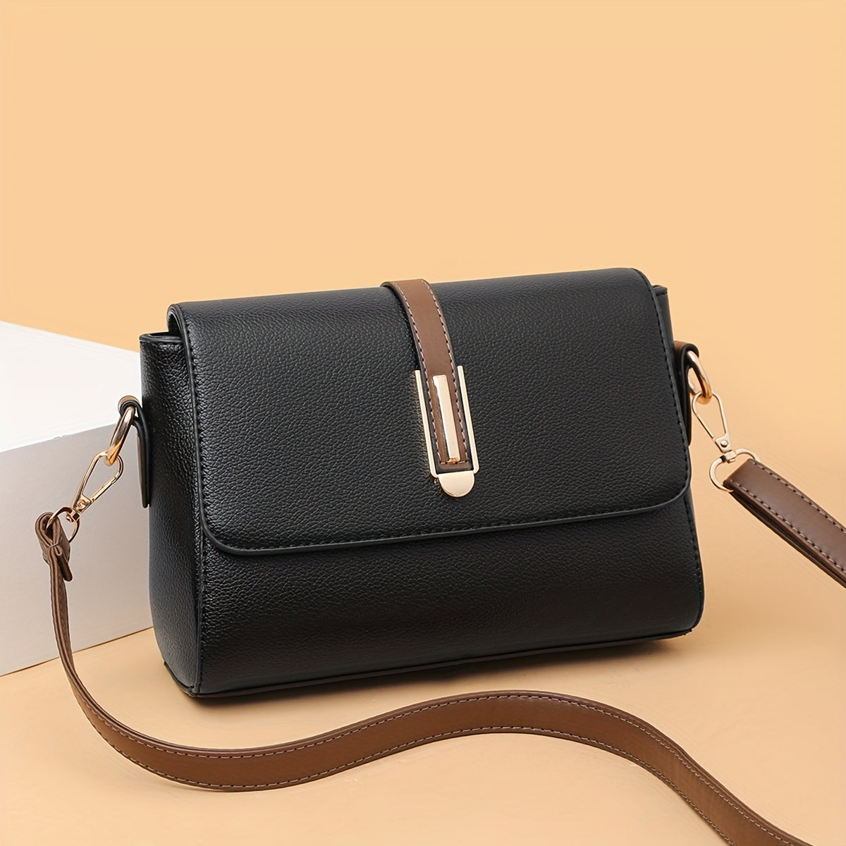 Women's fashion crossbody bag with zipper closure in black, khaki, or blue options. Made of polyester with edge paint detail.