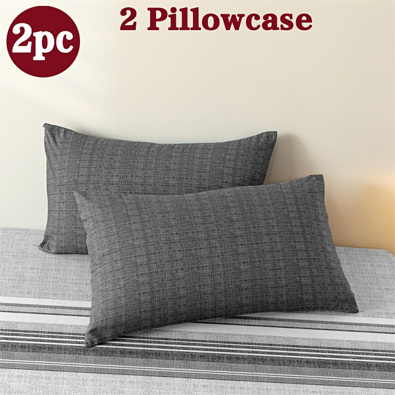 Two geometric print pillowcases made from soft and breathable polyester microfiber. These pillowcases are machine washable and feature an envelope closure for easy use. Perfect for adding a stylish touch to your home bedding, these pillowcases do not