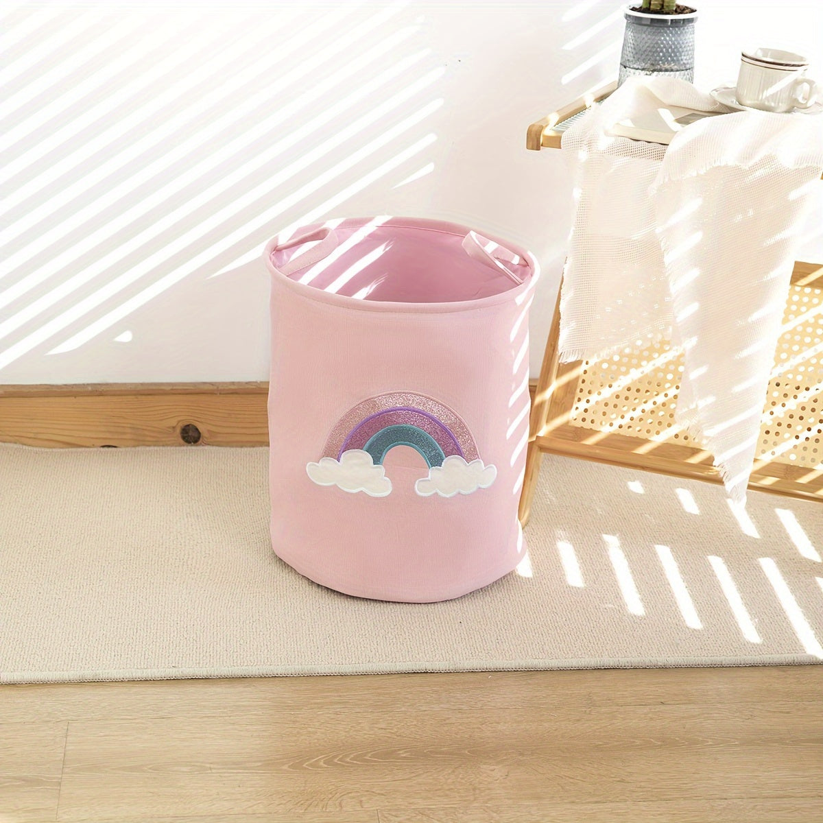 Pink round laundry basket with nursery fabric storage bin, perfect for home organization in bathroom, bedroom, living room, dorm, and home decor.