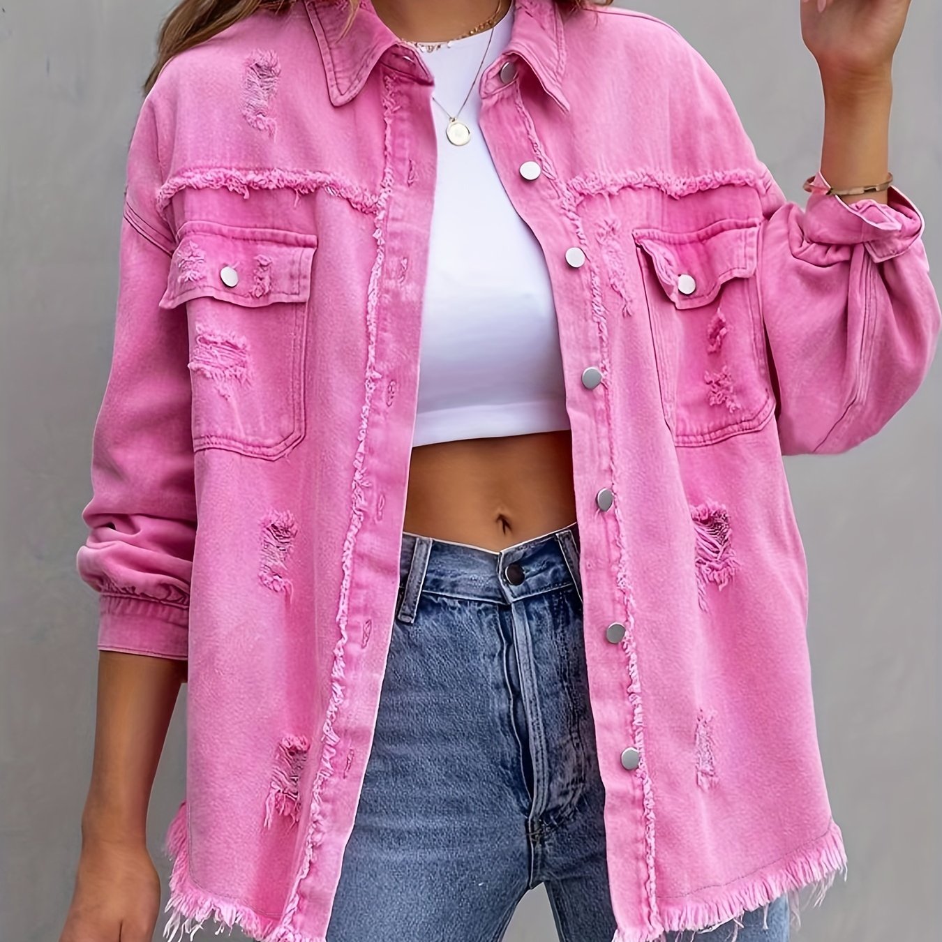 Women's plus size distressed denim jacket with boho style, button detail, and lapel collar made of rayon/viscose blend fabric. Suitable for spring/fall fashion.