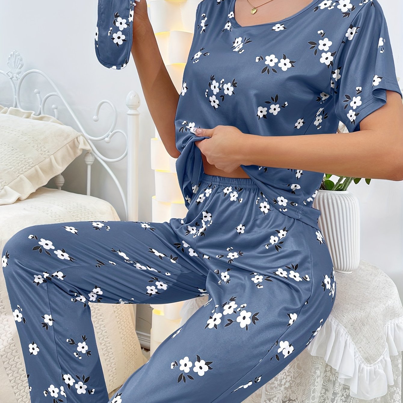 Women's sleepwear set with floral print loose pajamas, short-sleeve tee top, and pants.