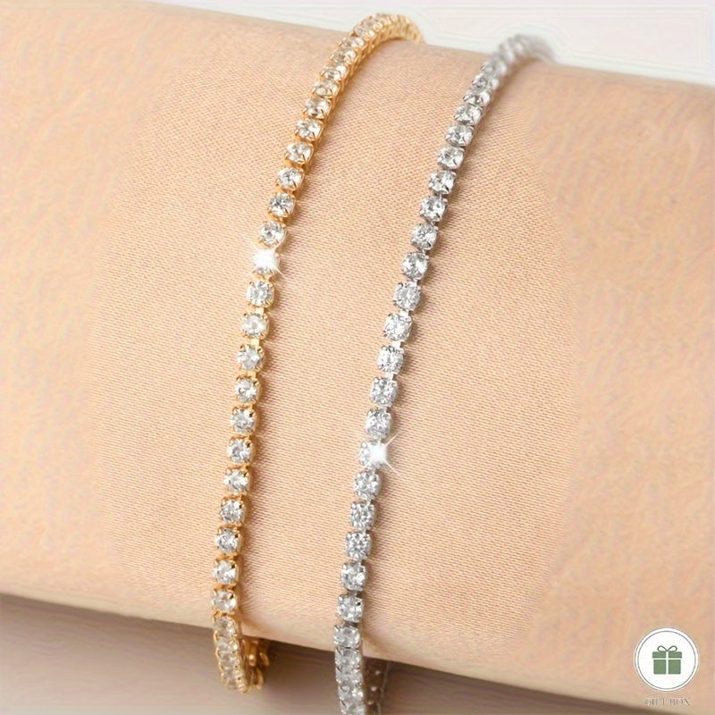 Golden plated copper hand jewelry accessory, featuring inlaid shiny zirconia stones in a tennis bracelet design. Perfect gift for Mother's Day.