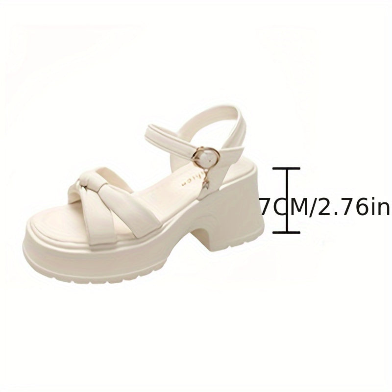 Stylish chunky heel sandals with knot design and buckle strap.