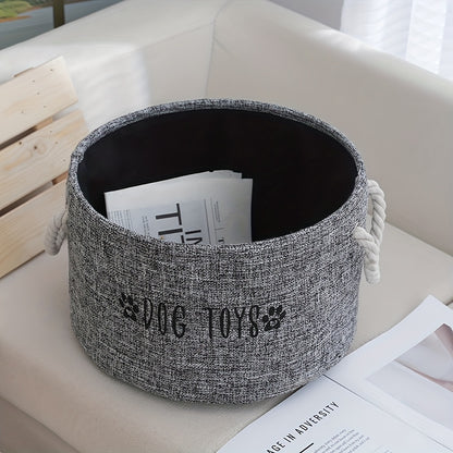 Canvas basket for storing dog toys.