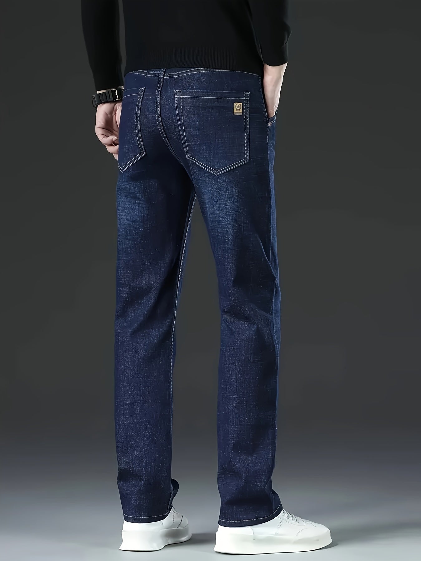 Men's straight-leg jeans in classic washed denim, made with a cotton-polyester blend and slight stretch for comfort. Solid color, regular fit, suitable for business casual attire.