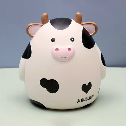 Cute cow-shaped penny bank, perfect for saving money and as a creative gift for birthdays and Christmas. Made of non-waterproof PVC with latch closure, ideal for desk decor.