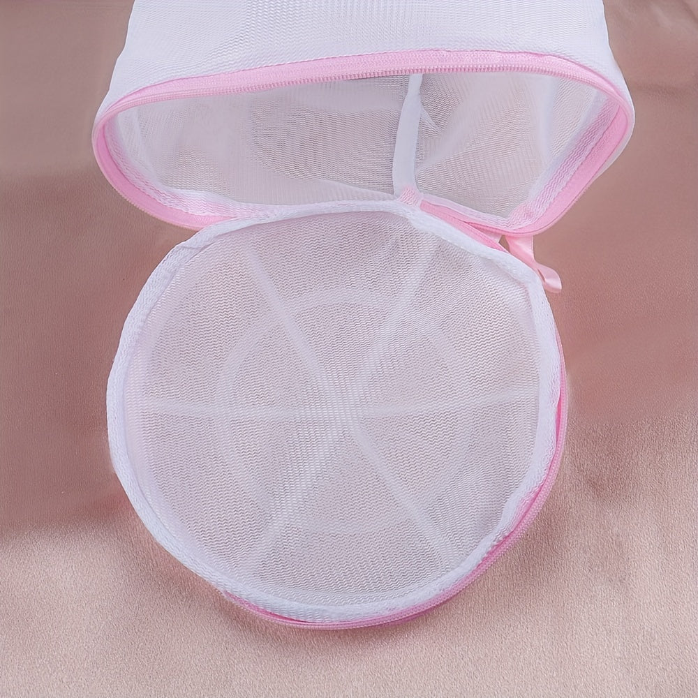 Sturdy polyester mesh laundry bag for delicates with fine grid, pink zipper. Hand washable, prevents deformation in washing machine. Breathable mesh design, laundry room essential.