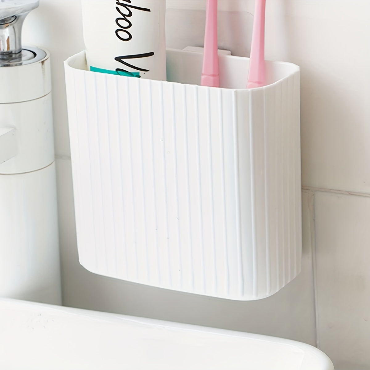 Wall-mounted toothbrush storage box for organizing toiletries, suitable for kitchen, bedroom, bathroom, office, and desk.