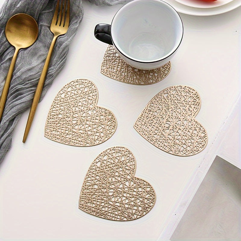 Set of 4 heart-shaped placemats and coasters made of PVC with heat insulation and non-slip features, ideal for household decoration and meal protection on dining tables.