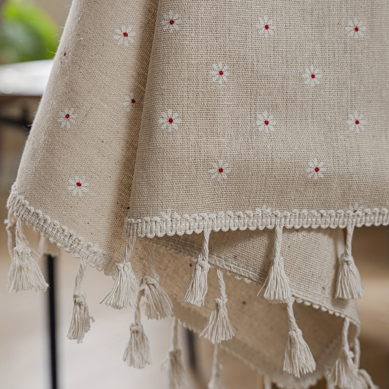 White chrysanthemum and beige linen print farmhouse floral tablecloth with tassels, ideal for kitchen and dining decor. Ready for Thanksgiving, made of polyester, rectangular shape.