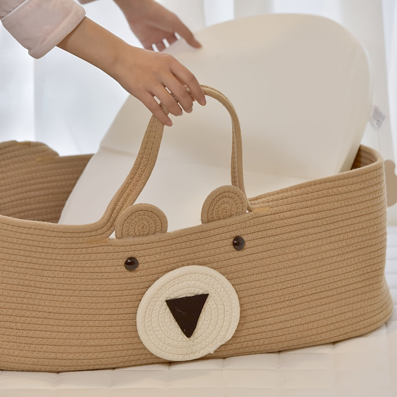 The LA DEARCHUU Portable Baby Crib features a charming Bear Design and a Foldable Fabric Cradle. It also includes a Multifunctional Weaving Storage Basket in Beige/Khaki. This product does not require batteries and is suitable for Newborns up to 3 years