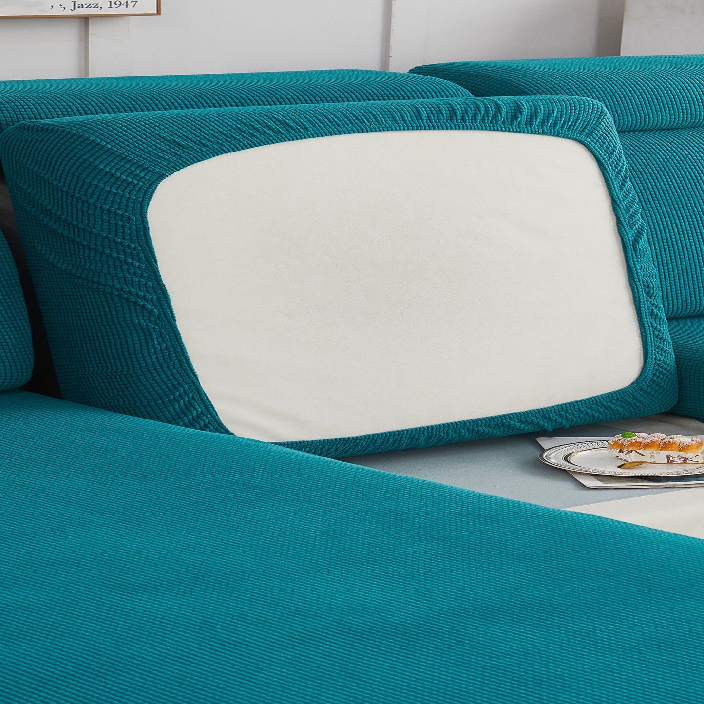 Durable sofa cover protects furniture from spills and stains.