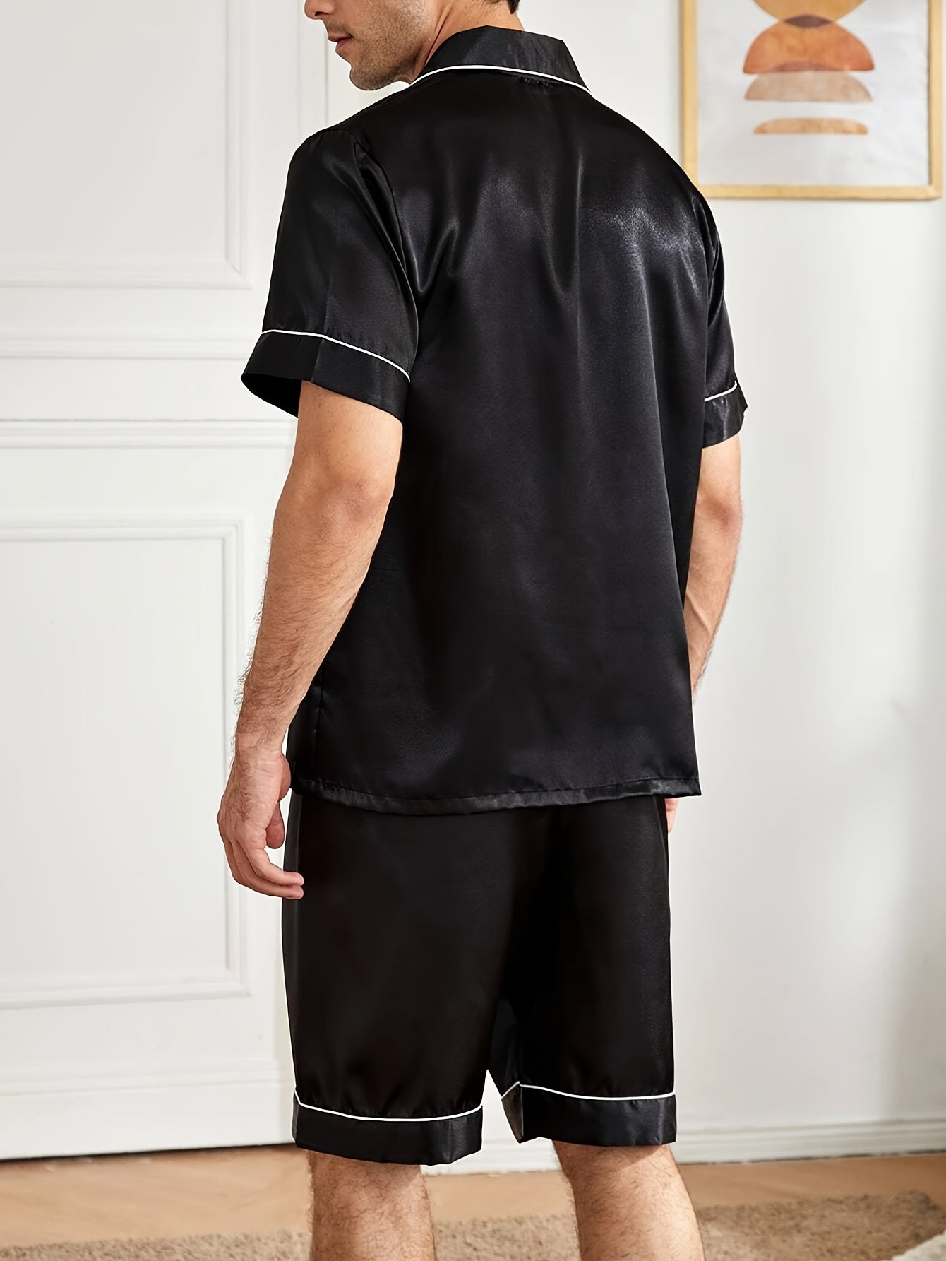 Men's casual solid color pajama set featuring a short sleeve button-up top and shorts. Made of a breathable polyester blend, machine washable. Perfect for spring/summer, leisure style.