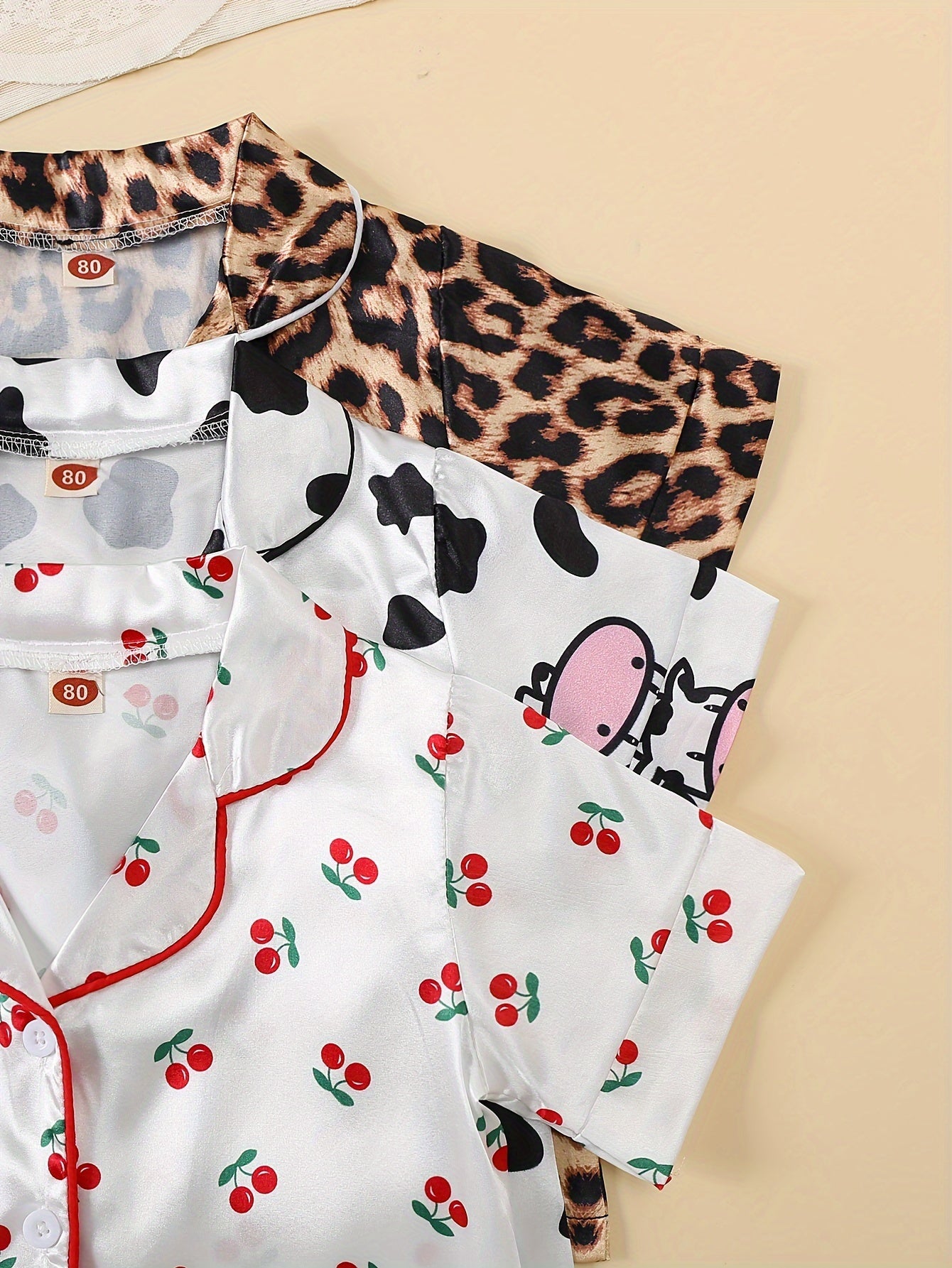 3-piece girl's ice silk clothing set features cute cow, rabbit, and leopard print. Comfortable and skin-friendly for daily wear.