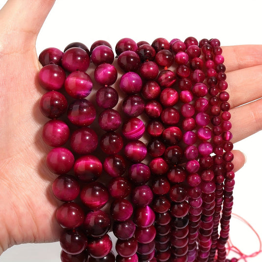 Smooth round beads of natural rose red Tiger's Eye in various sizes (4/6/8/10/12mm) for DIY jewelry making bracelets and necklaces.