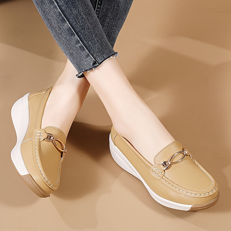 Versatile beige slip-on loafers for women with thick, non-slip soles and decorative buckle detail. Comfortable and lightweight for all-season wear.