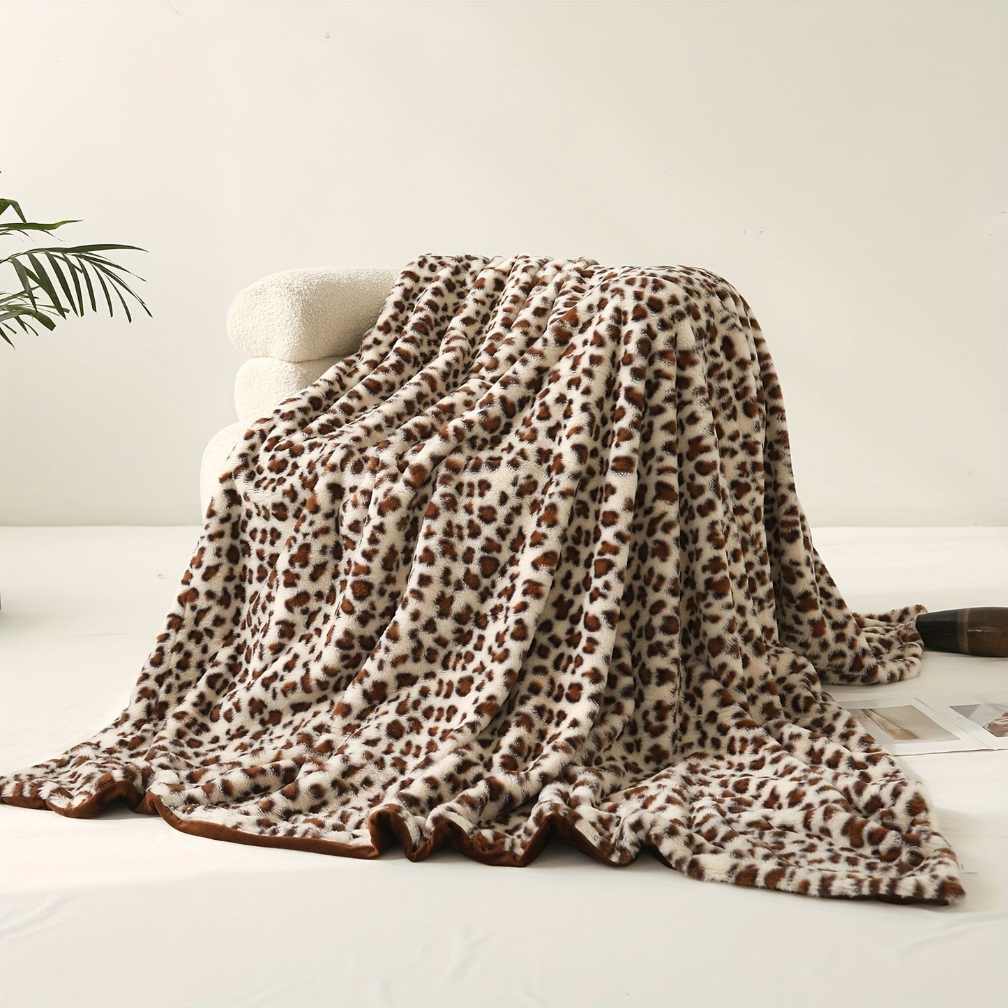 A versatile rabbit plush family blanket with a stylish leopard print design, perfect for all seasons and doubling as a cozy sofa blanket.