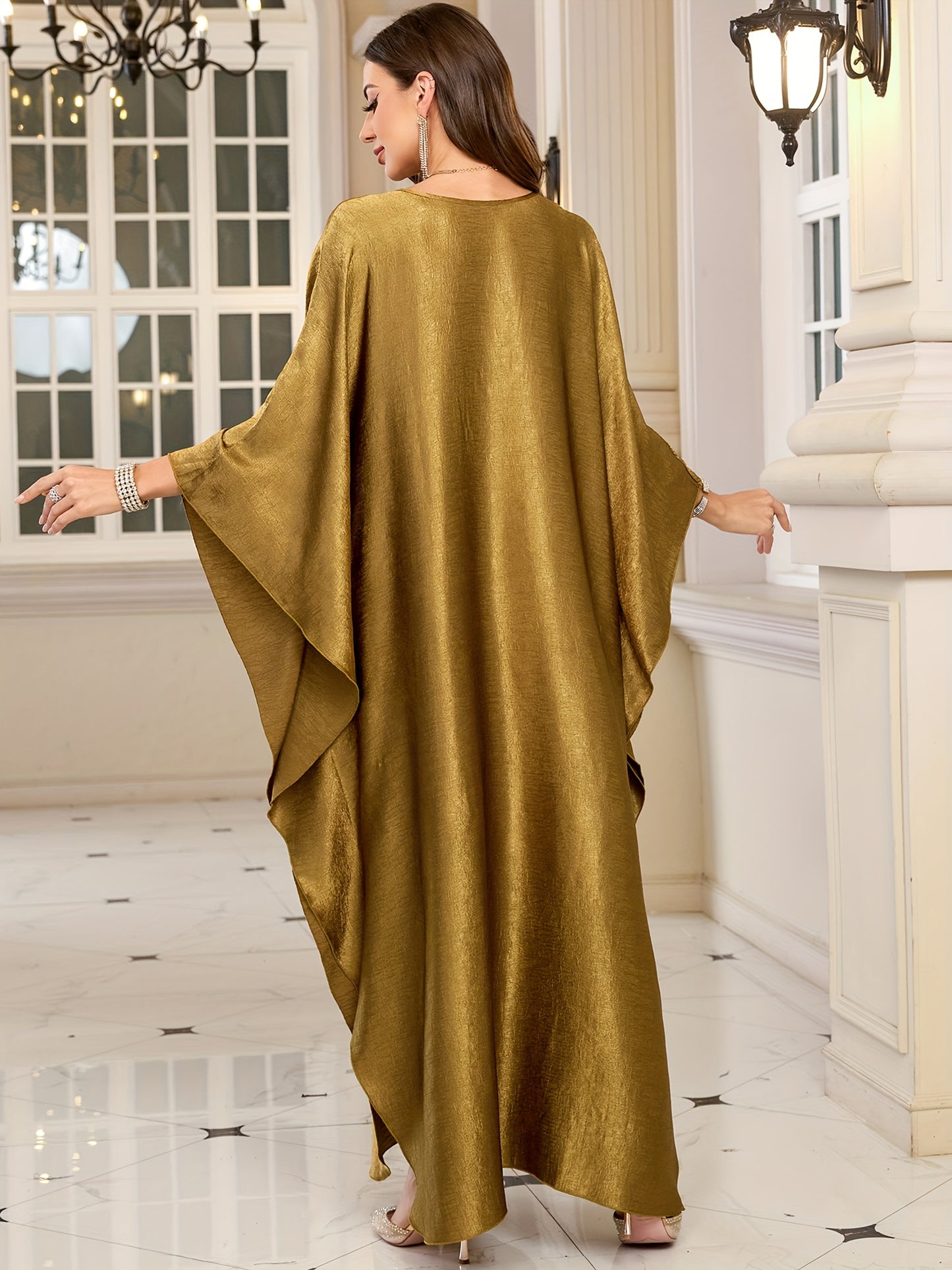 Stylish olive green V-neck kaftan dress with bat sleeves. Ideal as a beach cover-up or casual outerwear for women. Offers sun protection and a loose fit, perfect for spring/summer/fall