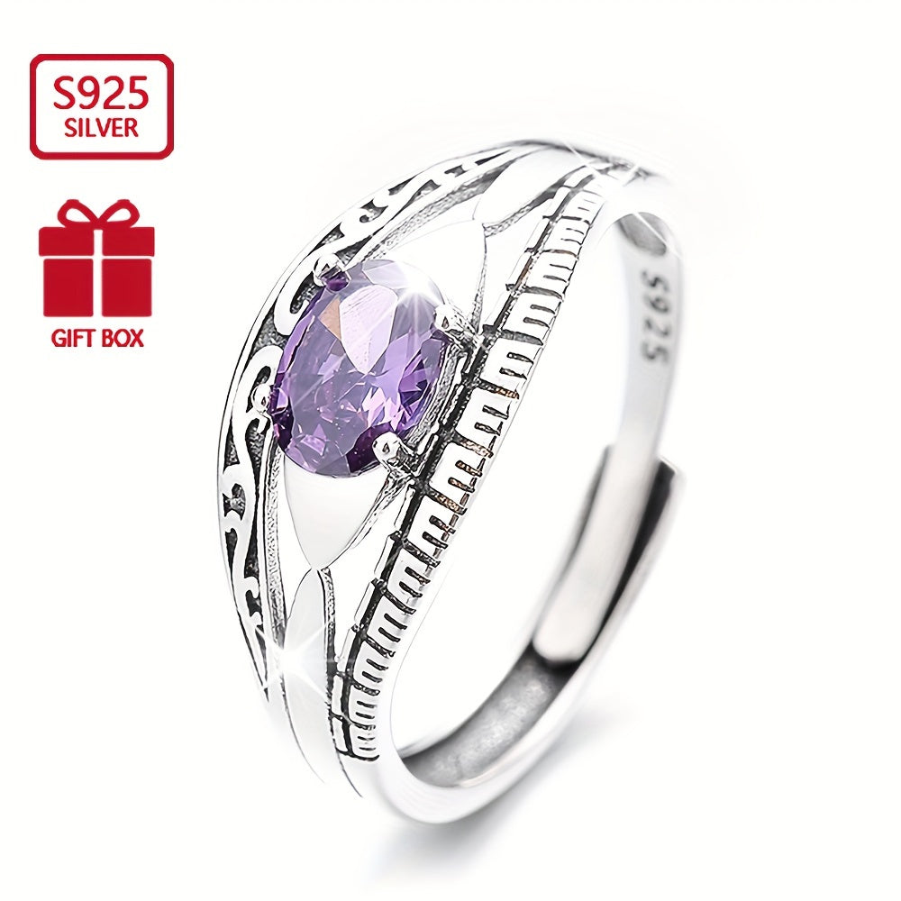 Beautiful and mysterious sterling silver ring with purple waterish zirconia inlay, symbolizing beauty and mystery. This high-quality adjustable ring is perfect for any occasion.