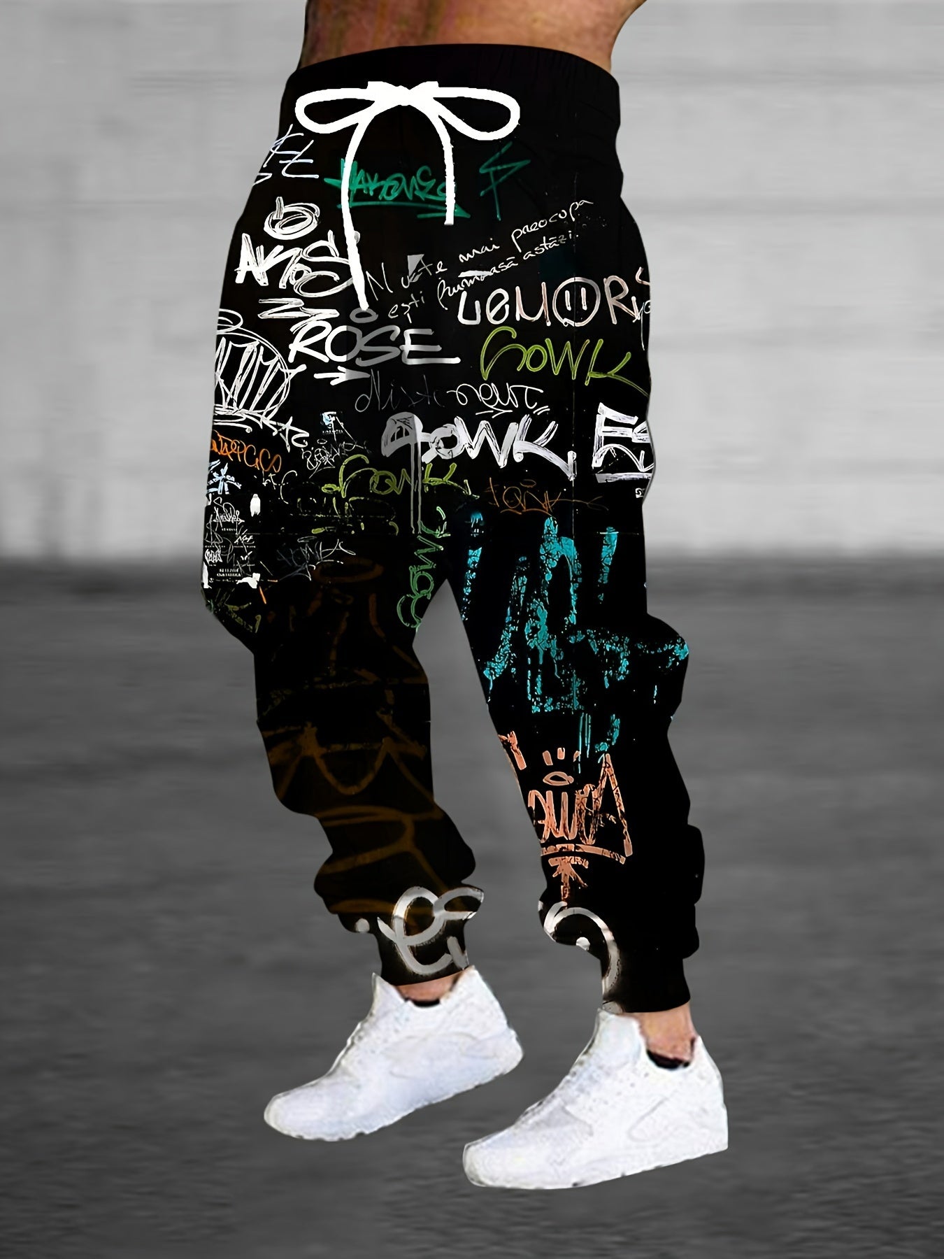 Men's polyester sweatpants with 3D graffiti print, drawstring, pockets, slight stretch, regular fit joggers.