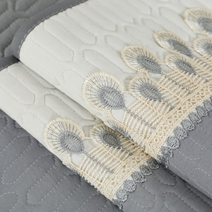 Luxurious Feather Embroidery Quilted Sofa Cover enhances and protects your couch.