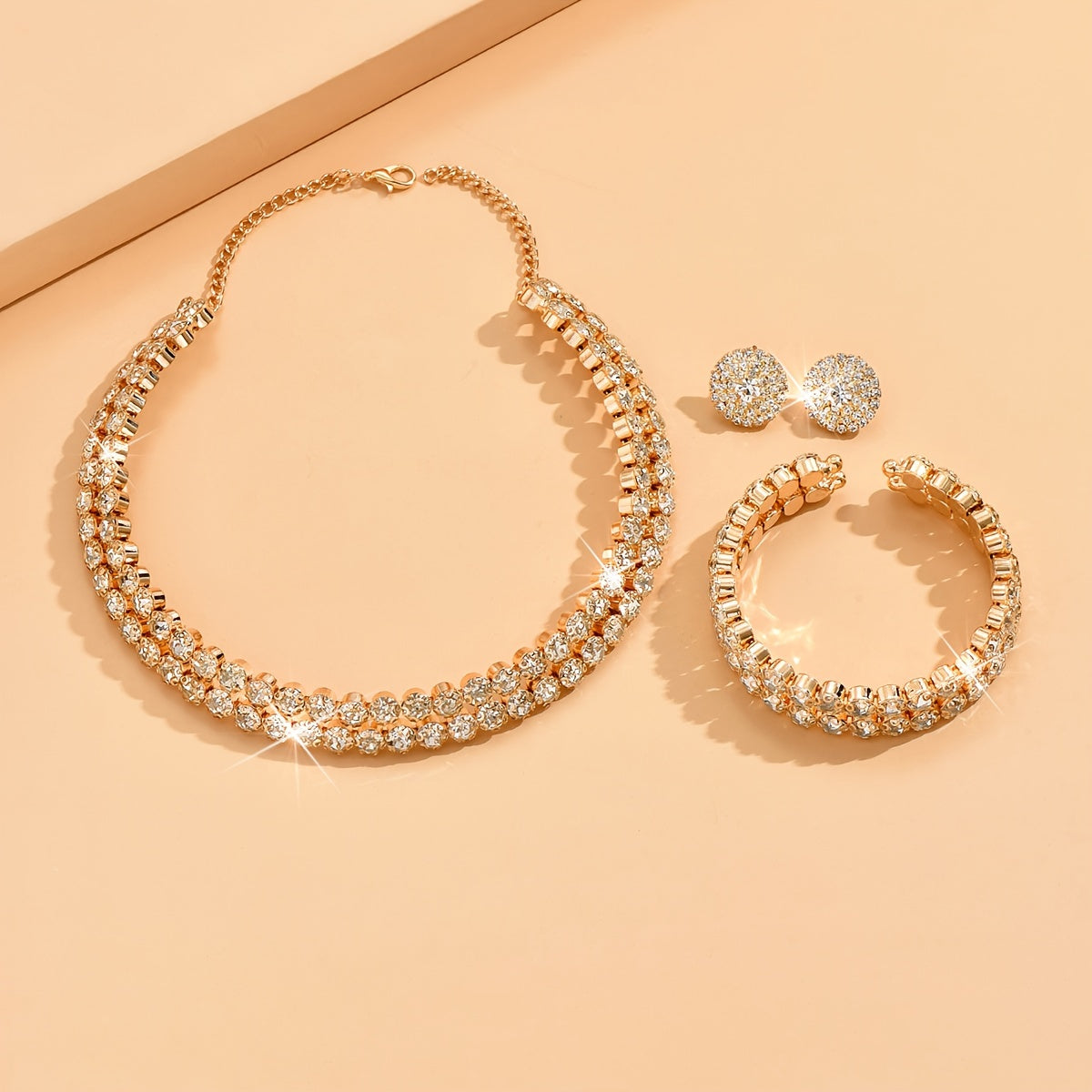 Elegant silver plated jewelry set featuring one pair of earrings, one necklace, and one bracelet all inlaid with shining rhinestones. Perfect for matching with daily outfits or as party accessories.