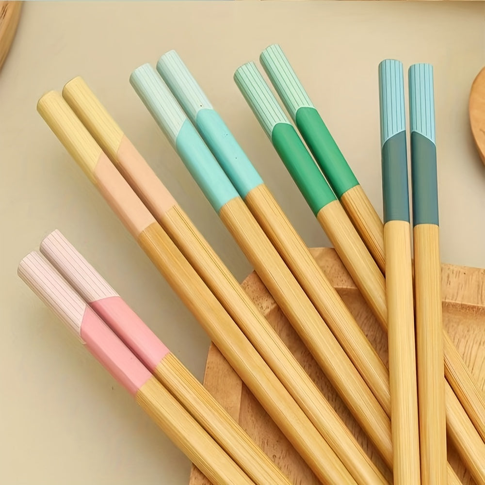 5 pairs of bamboo chopsticks that are antibacterial, anti-mold, anti-slip, carbonized, and high-temperature resistant. They are also reusable, lightweight, dishwasher safe kitchen supplies.