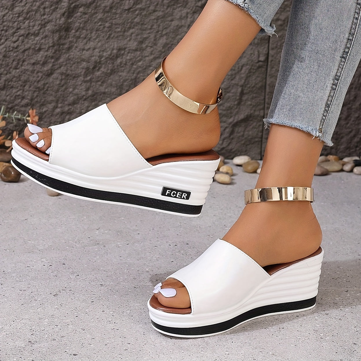 Women's white wedge sandals with a golden ankle accent and thick sole, perfect for casual summer wear.