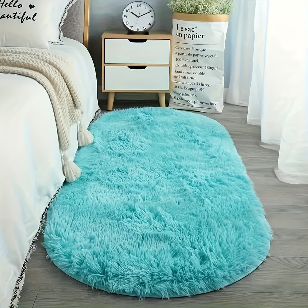 Soft faux fur oval area mat that is luxurious, plush, non-slip, hand washable, and durable. Perfect for adding a touch of elegance to your bedroom, living room, or home decor. Available in two sizes.