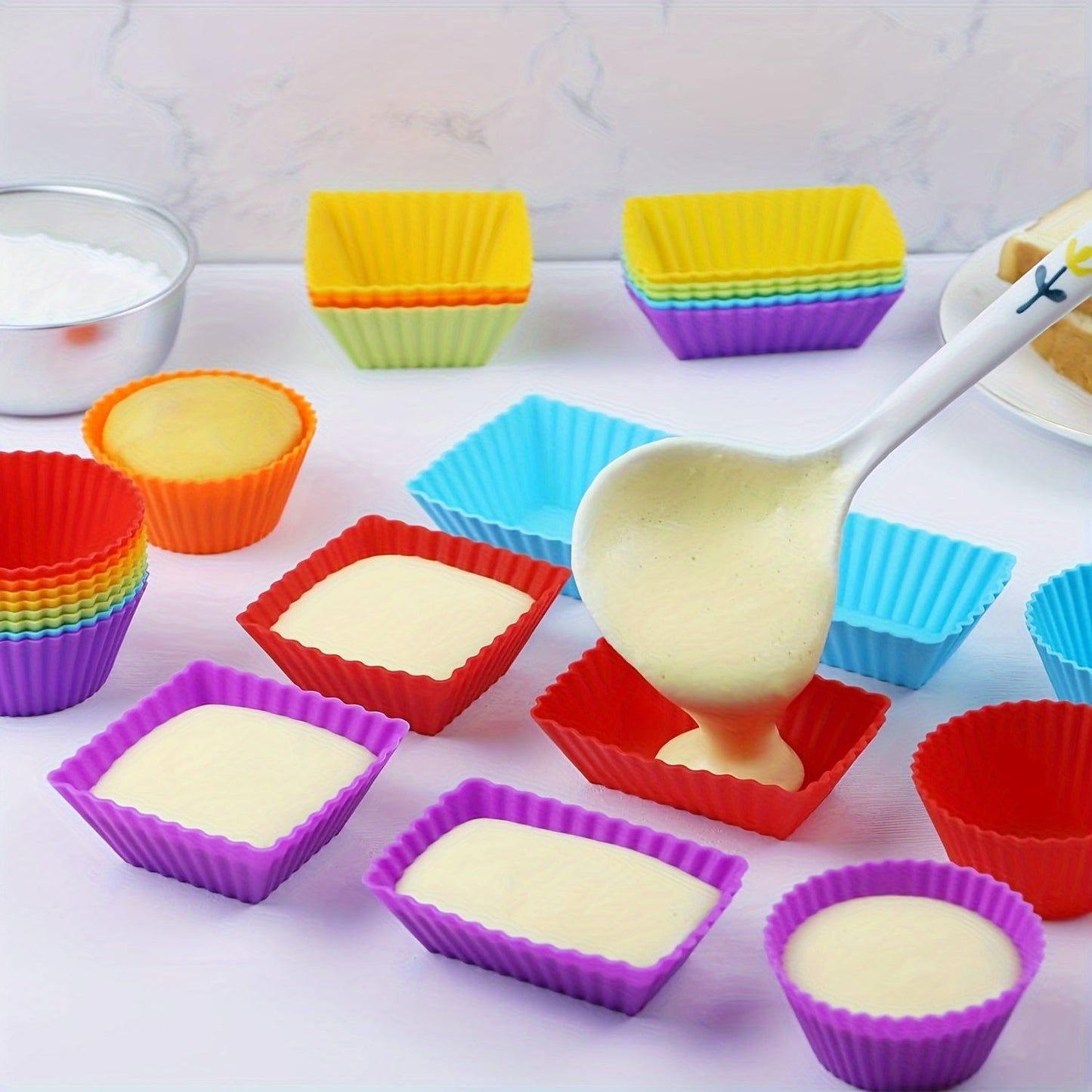 Reusable non-stick silicone baking cups for muffins and cupcakes, sold in packs of 12 or 24.