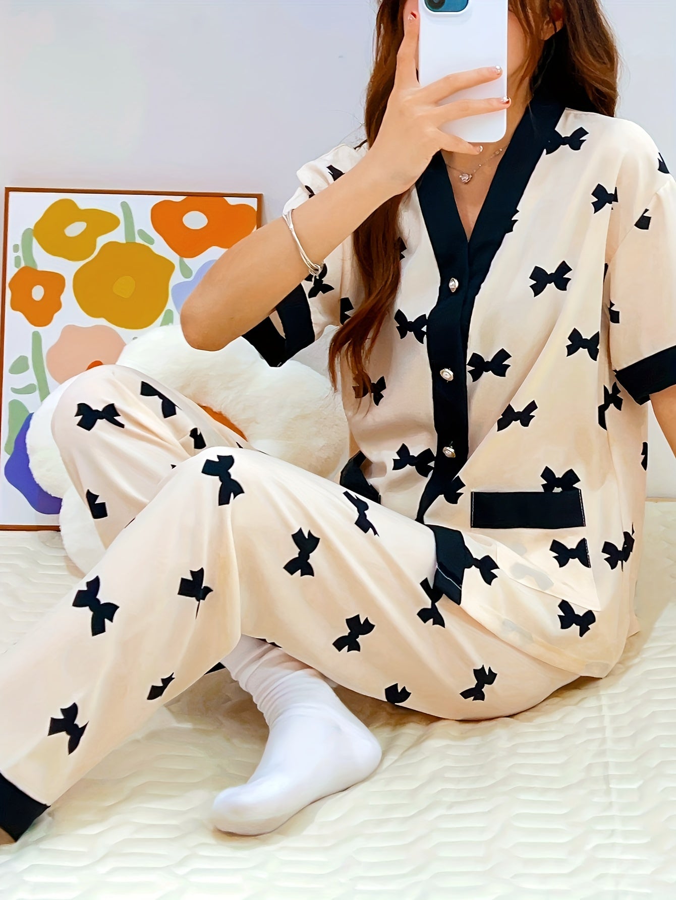 Summery short-sleeved women's pajama suit with sweet V-neck cardigan and thin material perfect for summer.