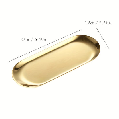 Golden-finish stainless steel oval tray - Minimalist design, durable and easy to clean. Ideal for serving bread, desserts, and snacks in stylish table settings.