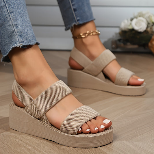 Stylish beige slip-on platform sandals for women, perfect for beach and travel. Features a comfortable thick sole and easy-care EVA material.