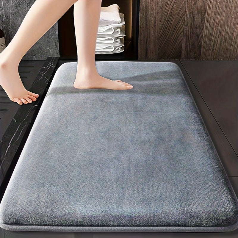 Soft and durable polyester bathroom mat with geometric design, ideal for shower, bathtub, bedroom, and living room. Versatile and non-slip, it is highly absorbent and machine washable.