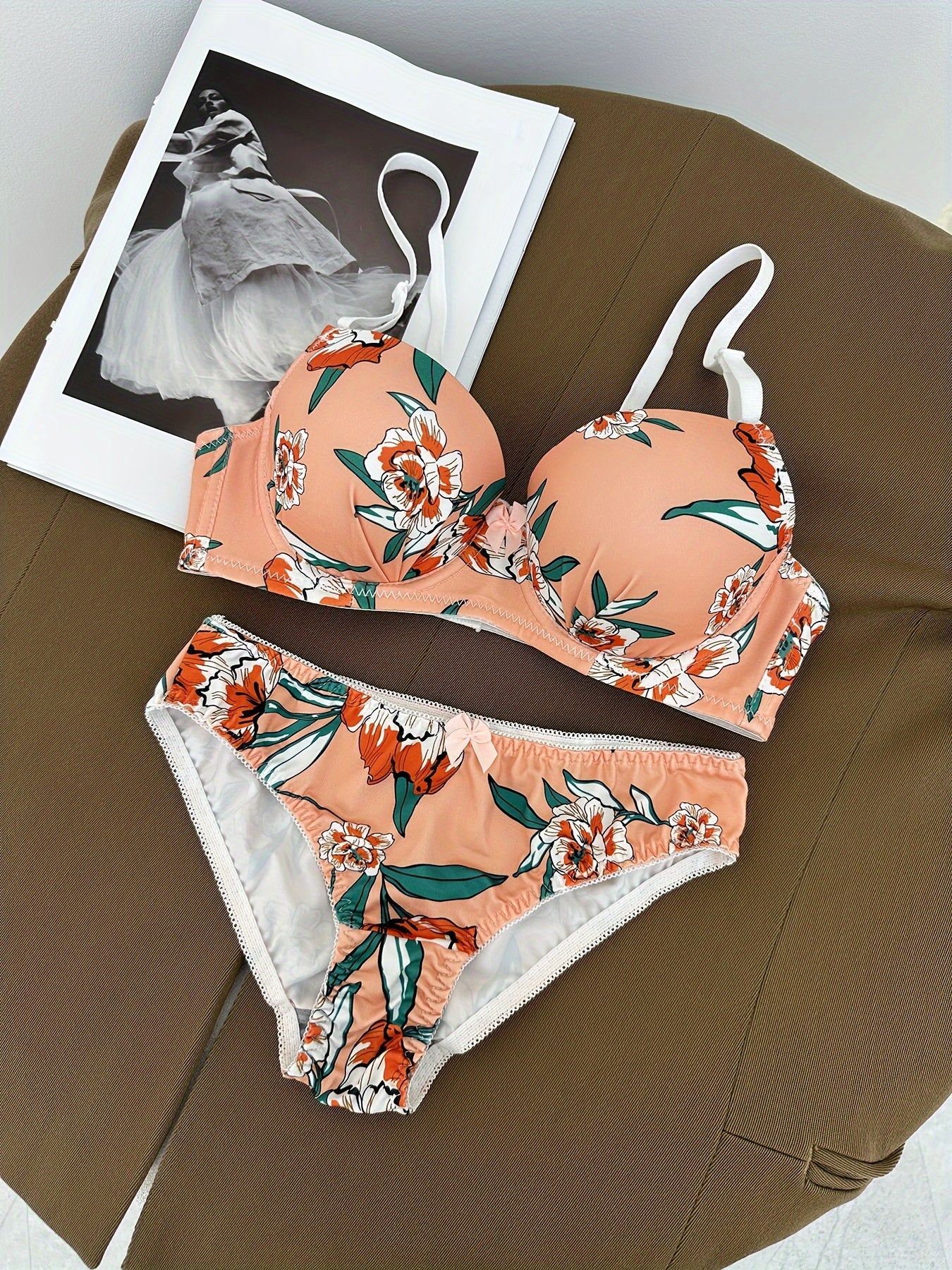 Floral bra and panty set with steel underwire and breast enhancement feature for women.