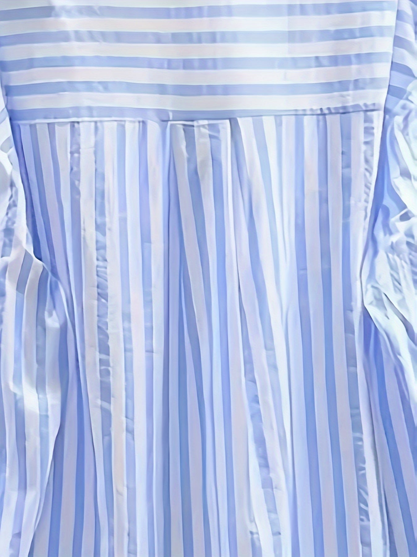 Women's blue and white striped long sleeve button-up shirt with collar, chest pocket. Made of lightweight polyester, machine washable. Suitable for all-season casual or dressy wear.