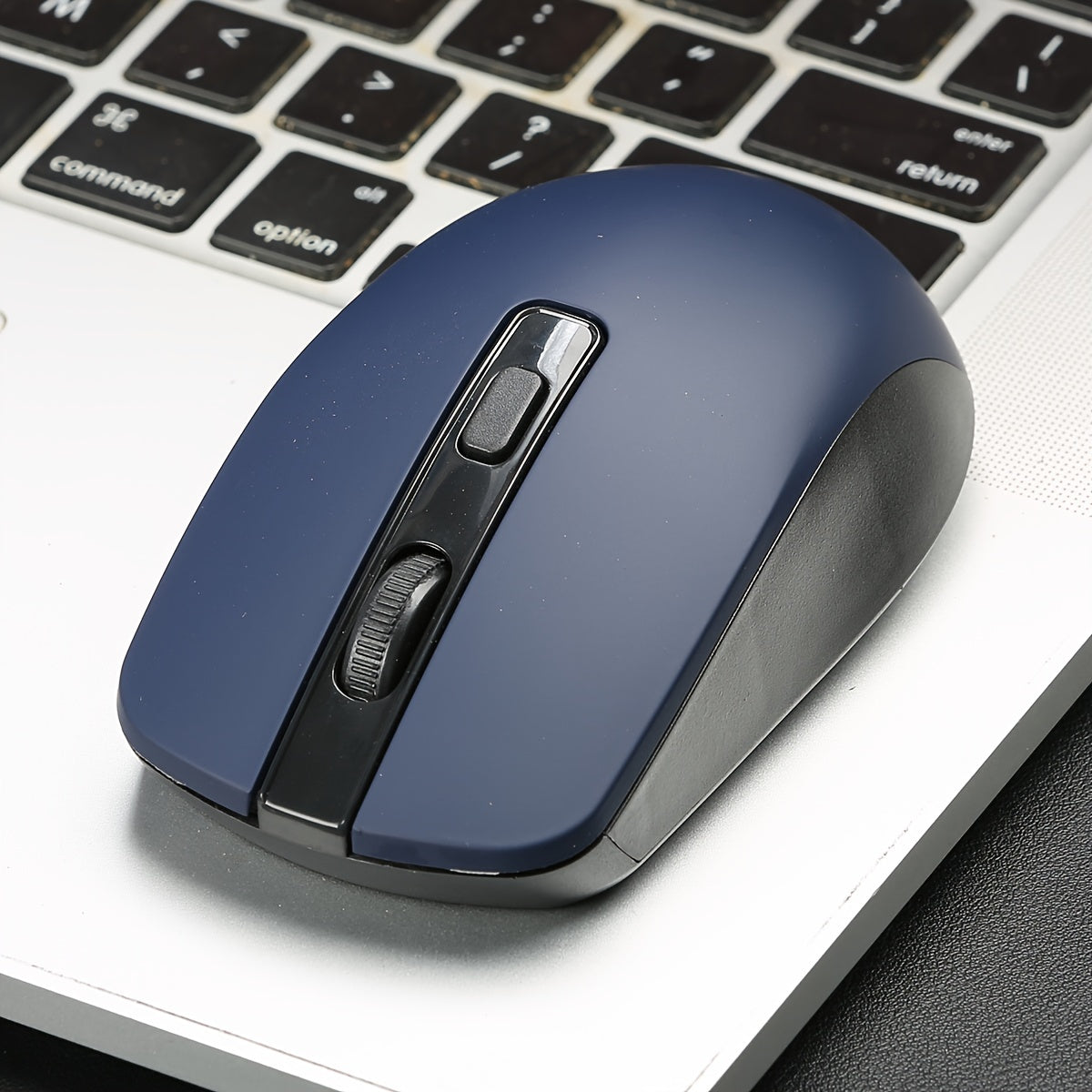 Battery powered 4D Button Wireless Optical Mouse with an ambidextrous plastic design for laptops and desktops - battery not included.