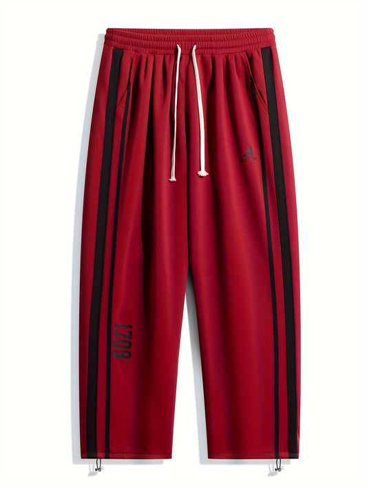 Stretchy geometric patterned track pants for adults, made of a polyester blend with a relaxed fit, suitable for all seasons and available in plus sizes.