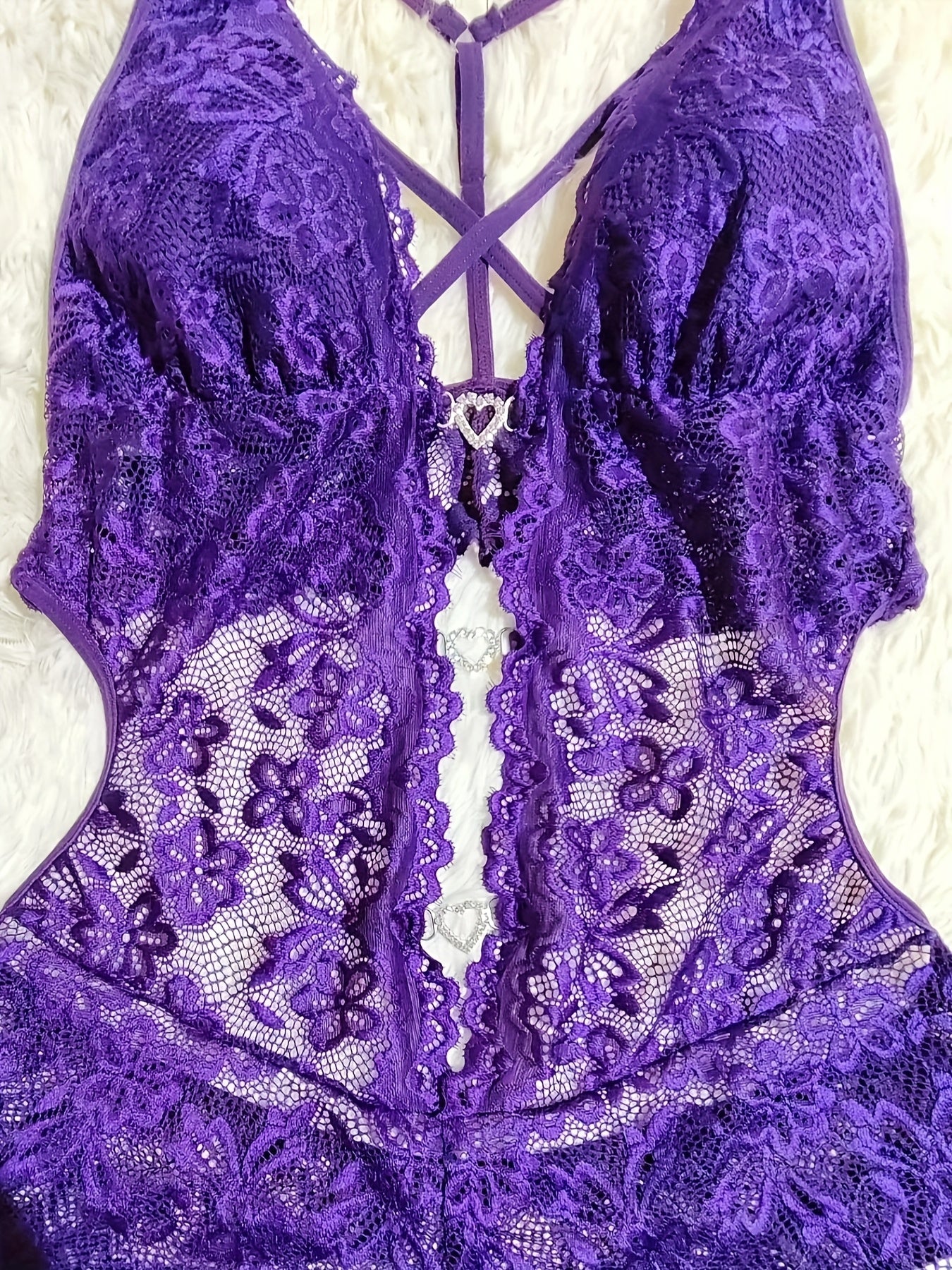 Sexy lace bodysuit with cross strap design and heart diamond detail, made of 95% polyester and 5% elastane knit fabric. No padding, fashionable one-piece lingerie for women.