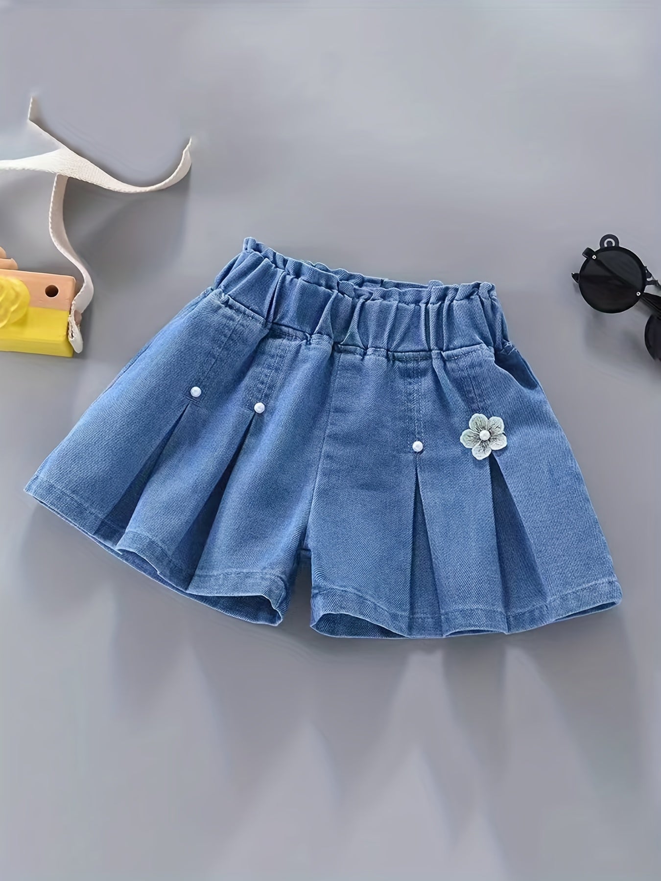 Girls' denim pleated skirt and ruffled shorts for summer, perfect for daily wear or beach holidays with a comfortable and elastic waist.