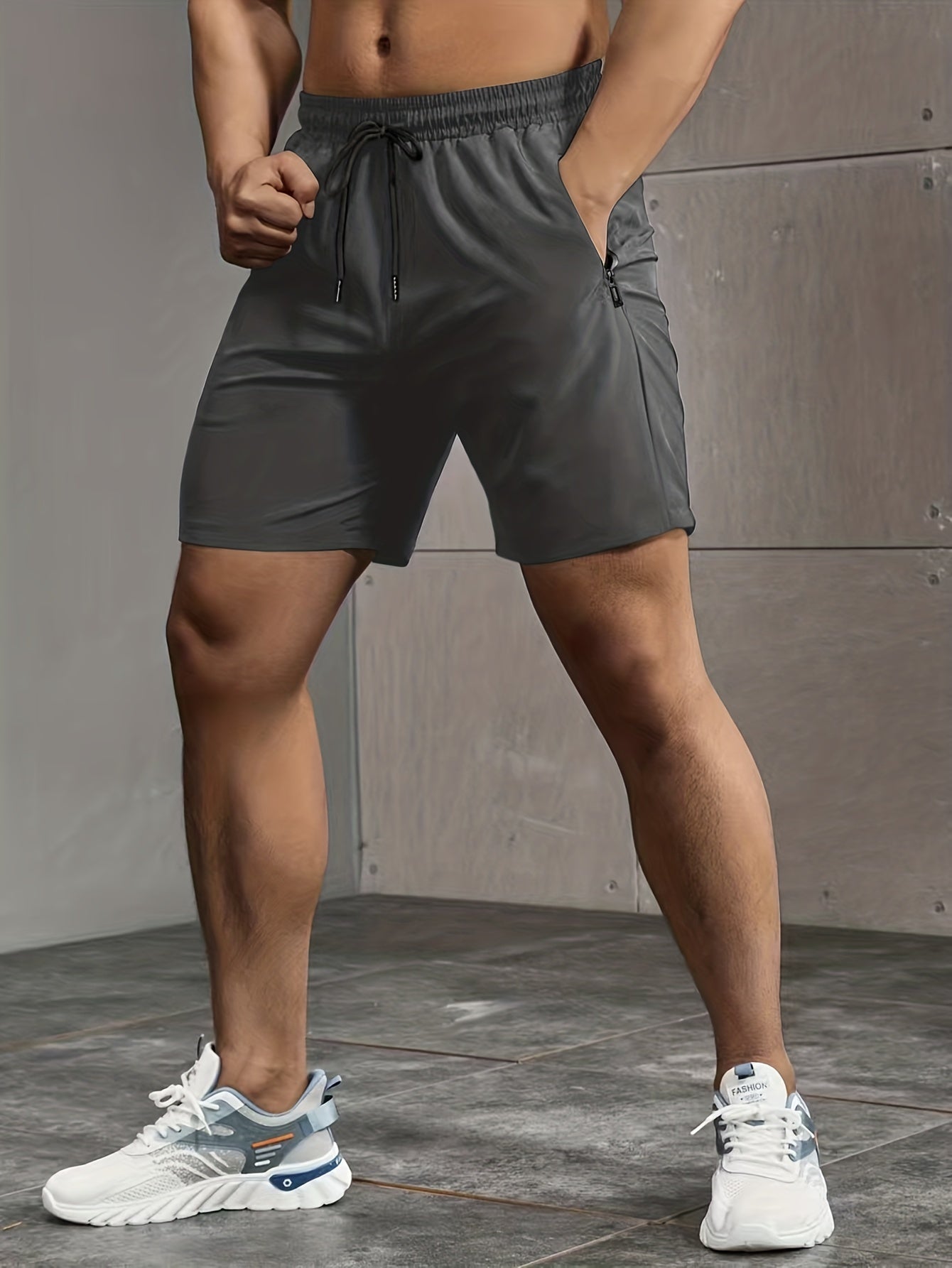 Men's casual style shorts with zip pockets, drawstrings, and performance letter print, ideal for summer outdoor activities.